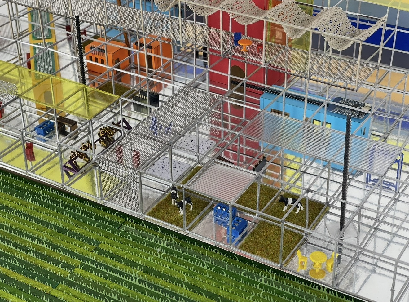 Detail of the model with mesh walkways, yellow panels and miniature fields