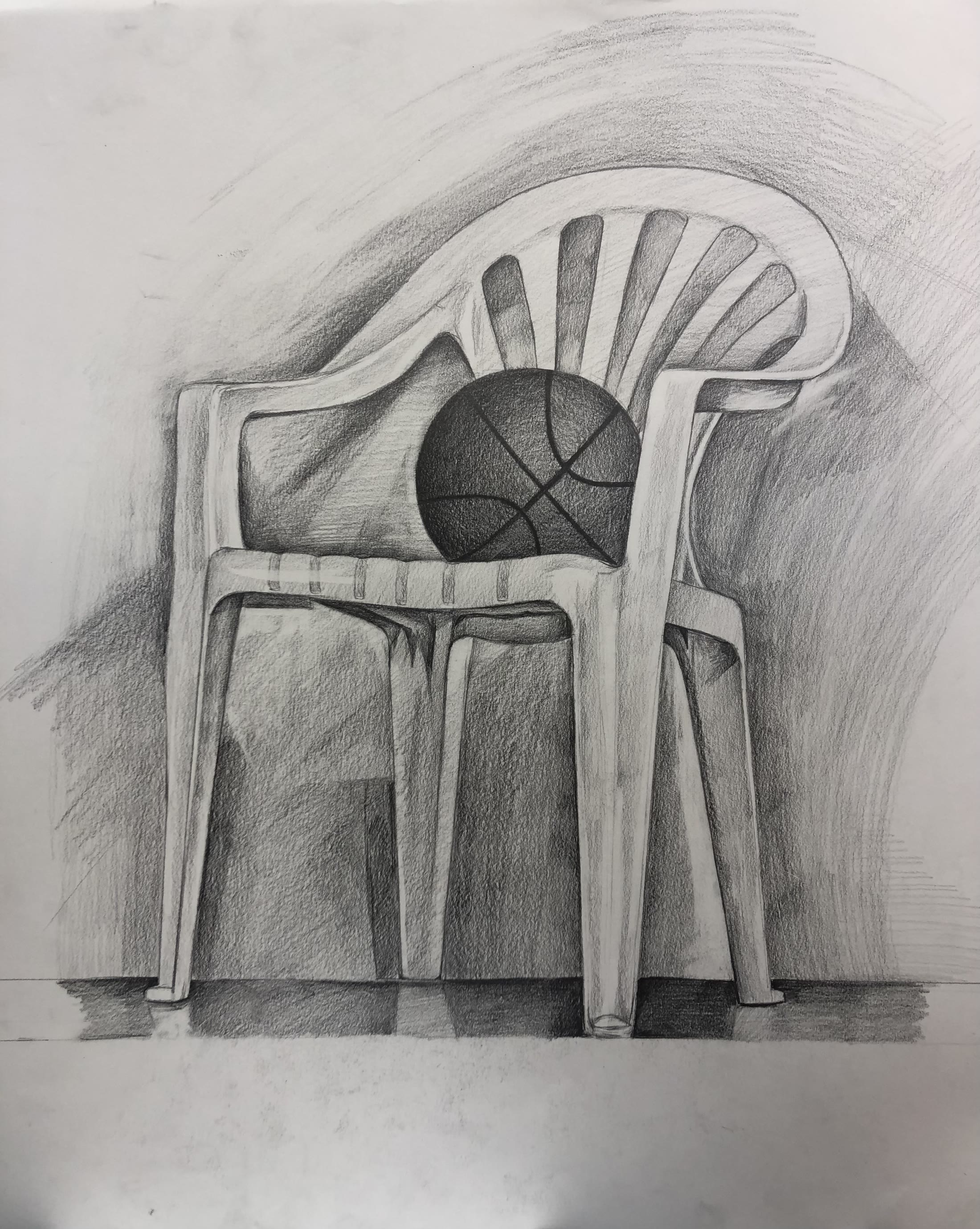 Graphite drawing of a moulded plastic chair with a basketball